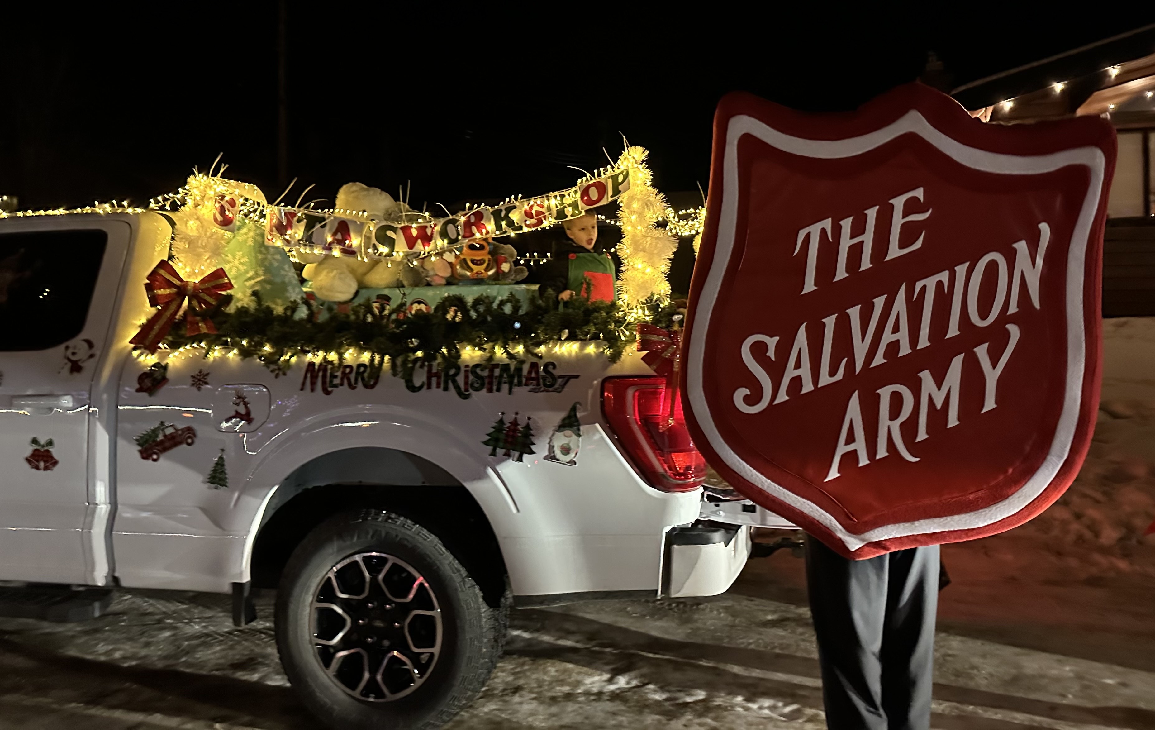 An outdoor activity showing a truck with the words 'Merry Christmas'