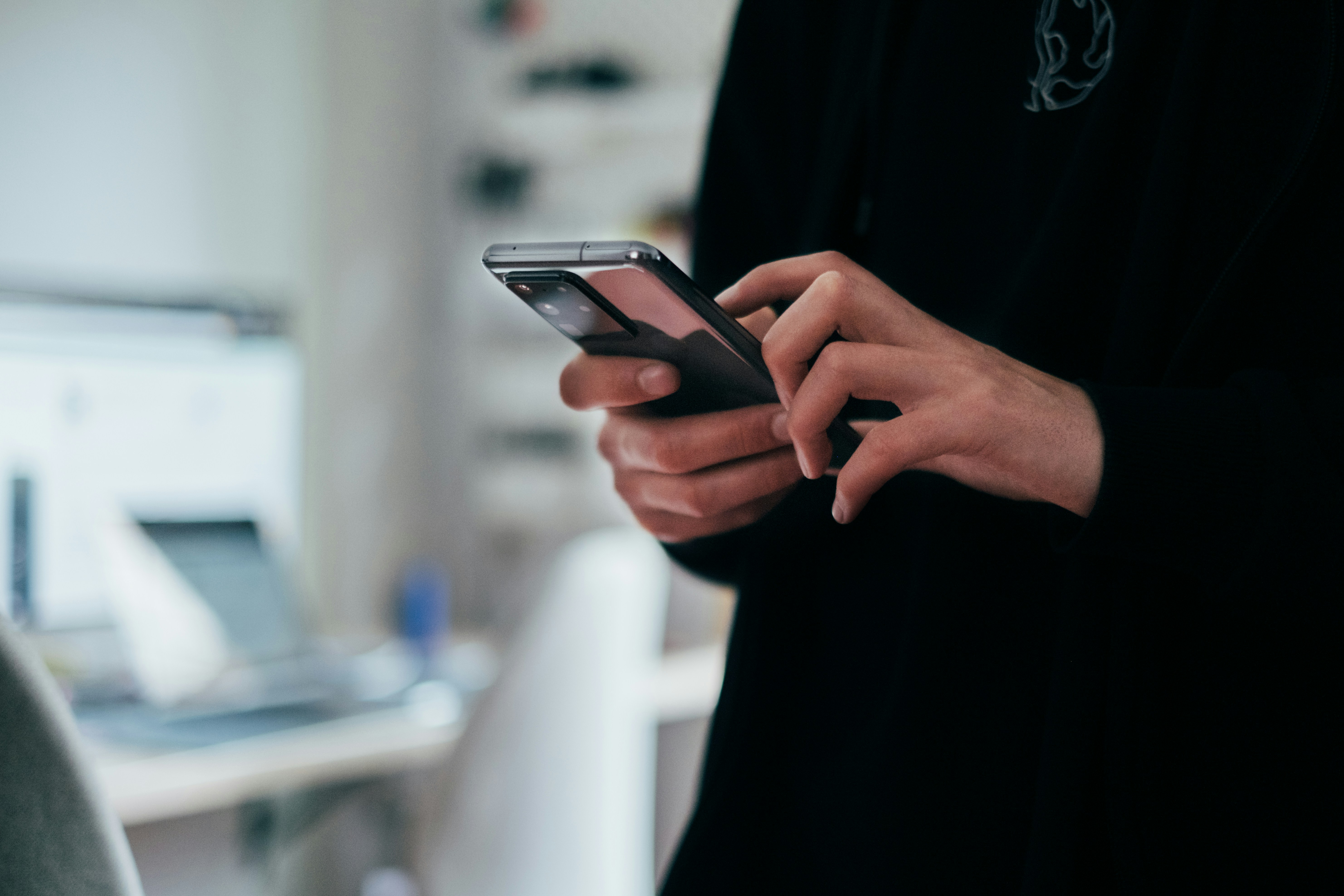 A person holding a mobile phone