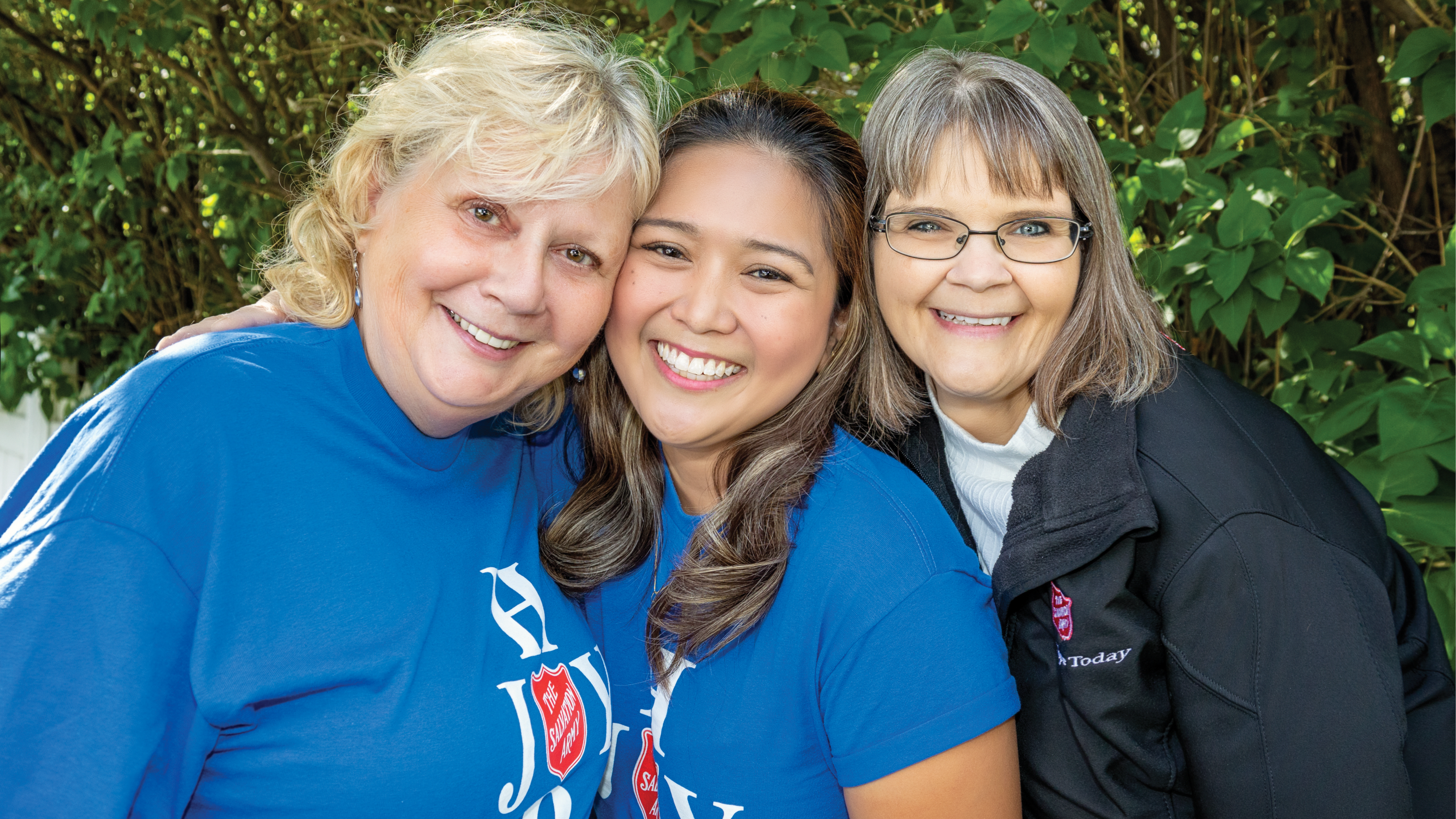 Three foothills team members smiling at the camera
